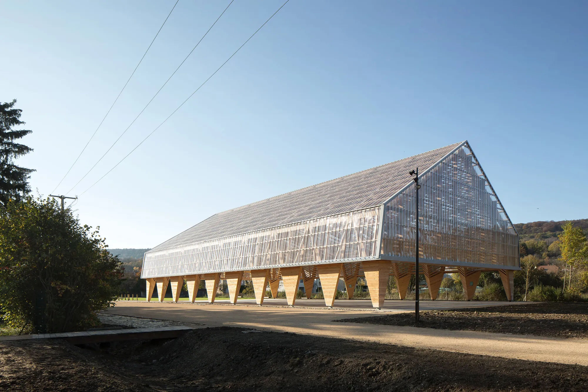 Wooden Hall in Ancy-Dornot by Studiolada – A Multi-Functional Timber Pavilion in France
