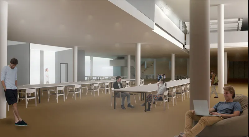 Interior reading hall with cylindrical columns, light wood tables, and occupants working beneath a low ceiling