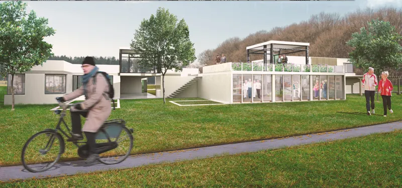 Street view of a low-slung white complex with glass walls and a cyclist passing on the adjacent path