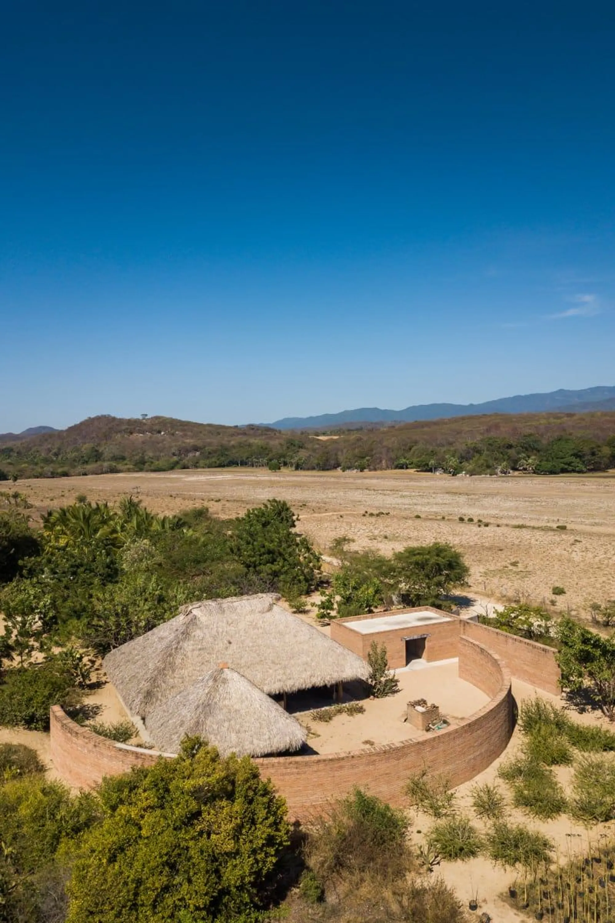The Clay Pavilion by Álvaro Siza + BAAQ': A Sculptural Brick Sanctuary for Tradition and Community