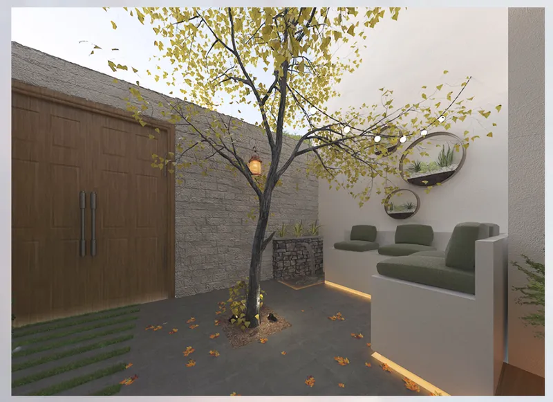 Interior courtyard with tree shedding yellow autumn leaves beside green upholstered seating