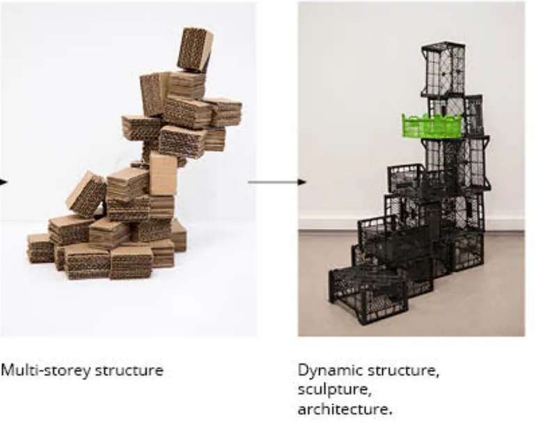 Physical model transitioning from stacked cardboard volumes to black wire-frame crates with one green crate