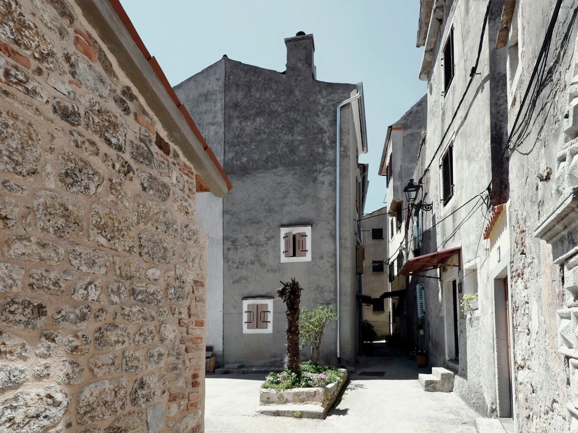 Pier-Lighthouse by OFIS Architects: Minimalist Stone Renovation on Cres Island, Croatia
