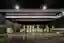 This architectural image showcases the interior of a large warehouse, characterized by its high ceil