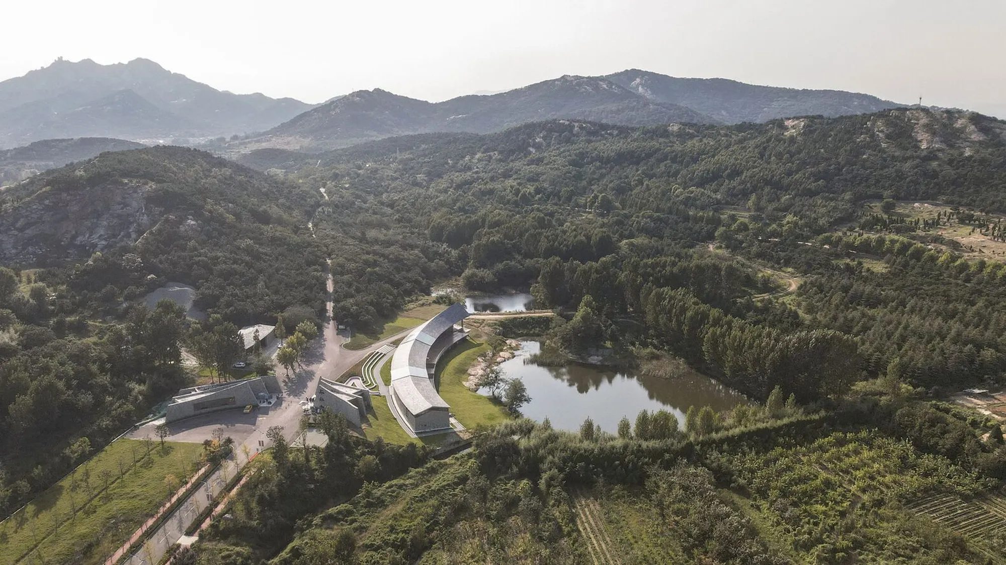 Dragon Mountain Tourist Center by Aurelien Chen: Architecture Rooted Between Earth and Sky