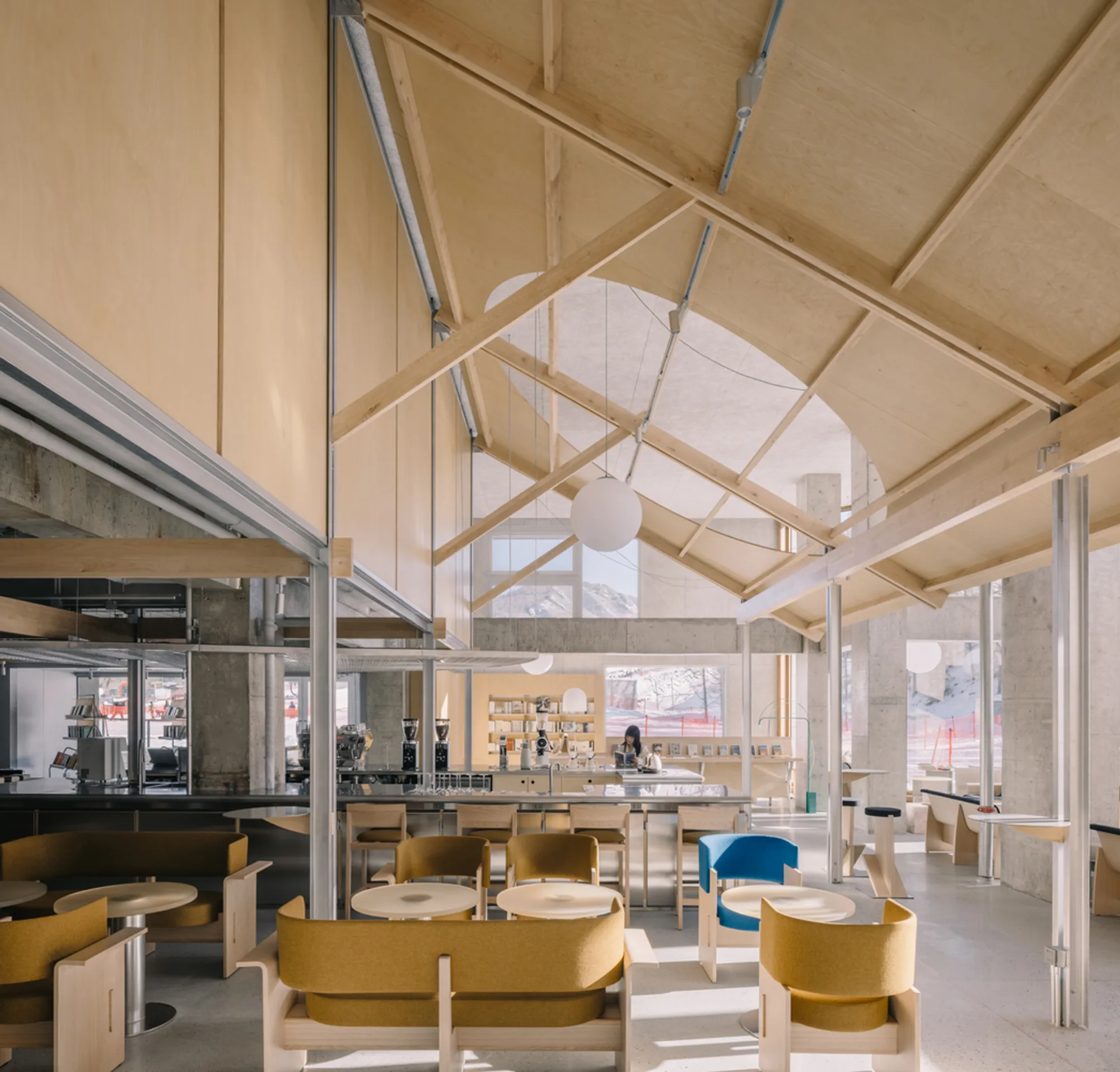Naïve Bookstore by atelier tao+c: A Luminous Retreat Amid Snow-Covered Slopes