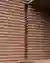 This architectural image showcases a close-up of a brick wall with a distinctive horizontal layering