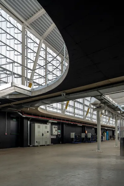 This architectural photograph showcases the interior of an industrial building with a modern design.