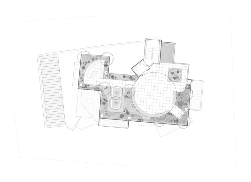 Floor plan drawing showing a circular central volume surrounded by planted terraces and linear circulation spine