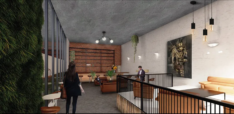 Interior bar space blending industrial textures with warm social atmosphere within the adaptive reuse framework.