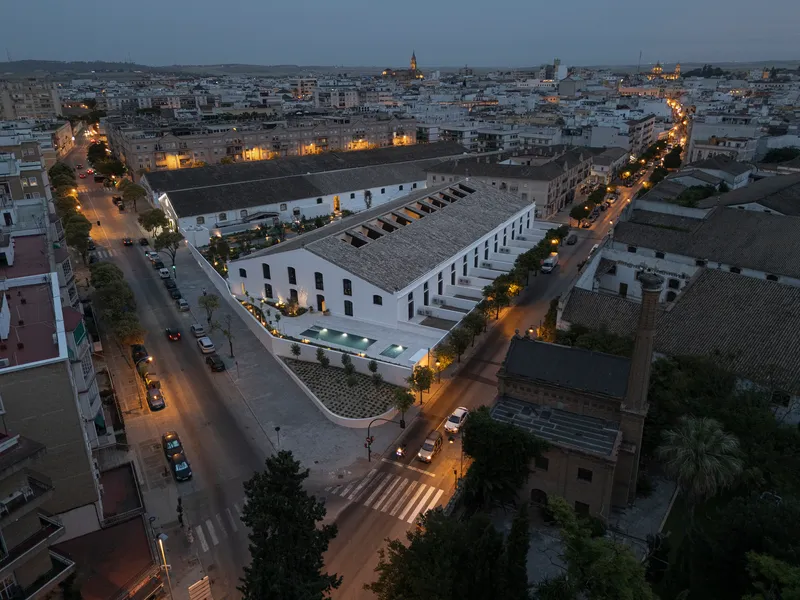 Aerial dusk view of the converted sherry bodega complex in Jerez de la Frontera