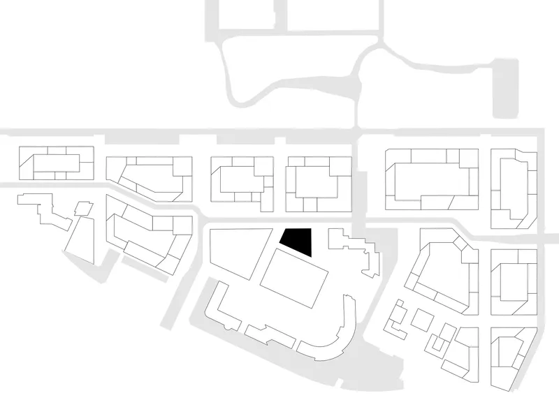 Site plan drawing showing building footprint in black within surrounding urban block structure