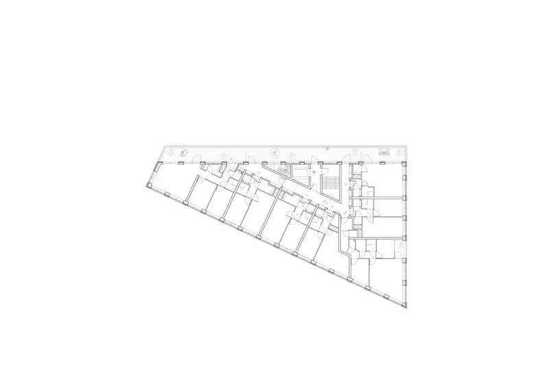 Floor plan drawing showing upper level with angled perimeter and central circulation core