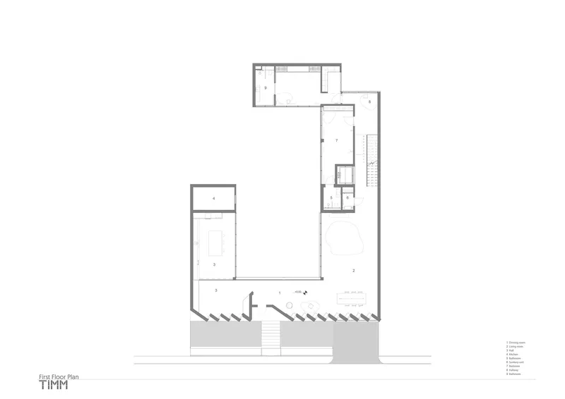 First floor plan drawing showing living areas with central staircase and cantilevered terraces