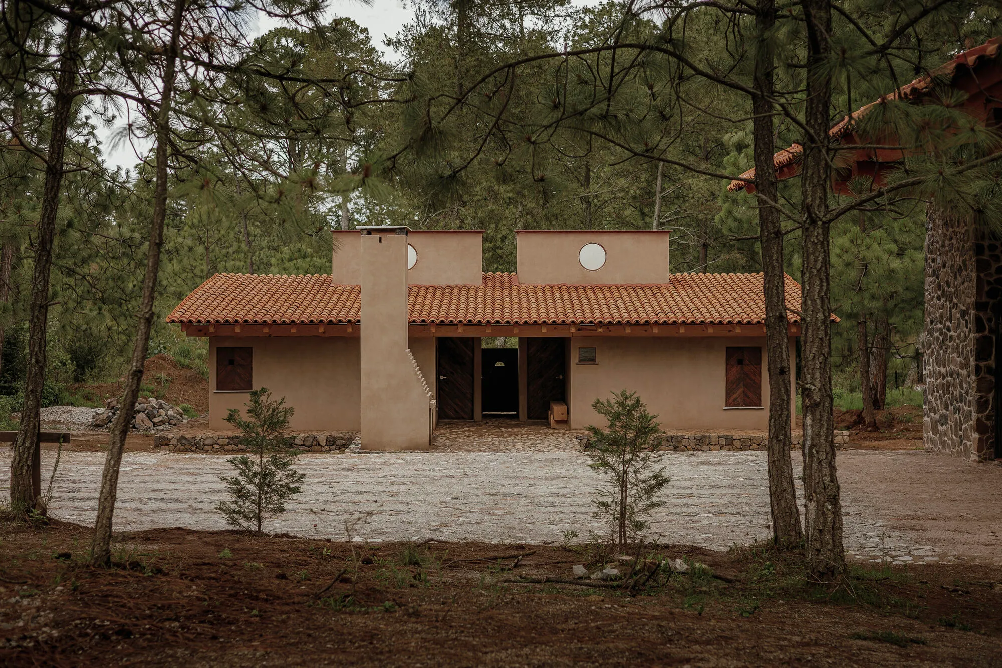 Night Watchman’s Cabin: A Minimal Forest Dwelling Rooted in Stone, Timber, and Silence