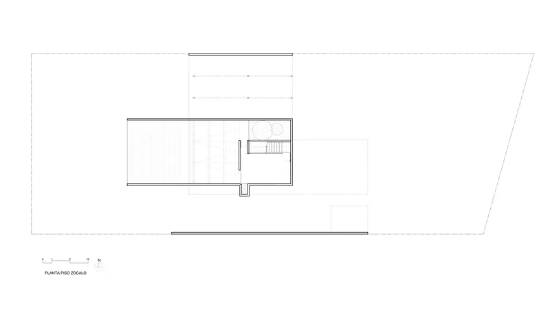 Second floor plan drawing showing a compact volume with stair and bathroom adjacent to exterior terraces
