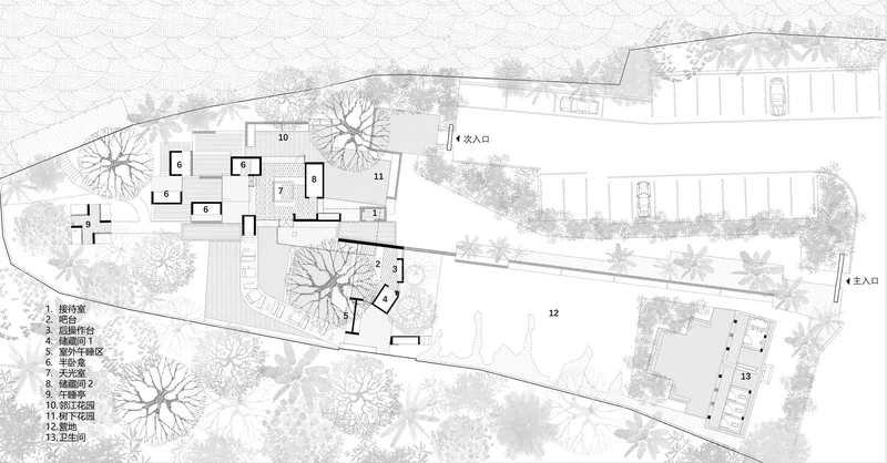 Site plan drawing showing scattered building clusters and parking areas across a sloped landscape with trees