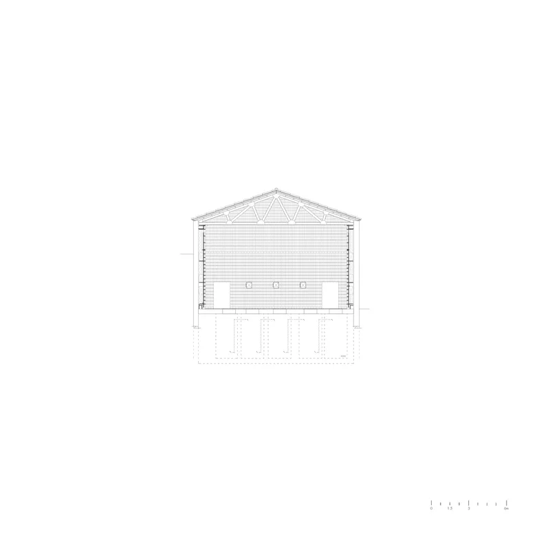 Section drawing showing the gabled roof structure with exposed trusses above a double-height space