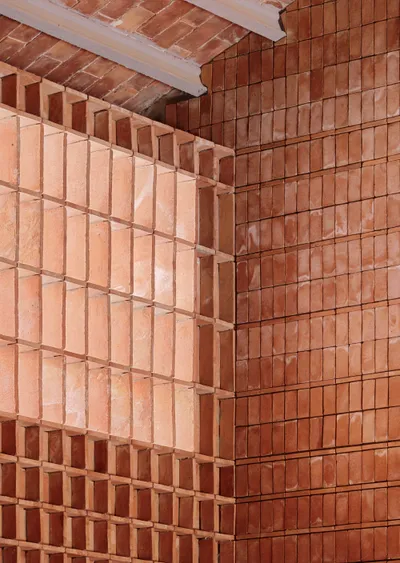 This architectural image showcases a detailed view of brickwork, featuring two distinct patterns. On