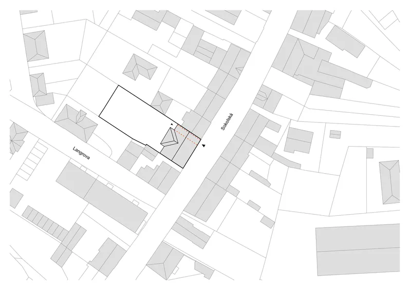 Site plan drawing showing the building footprint outlined in black among surrounding structures and streets