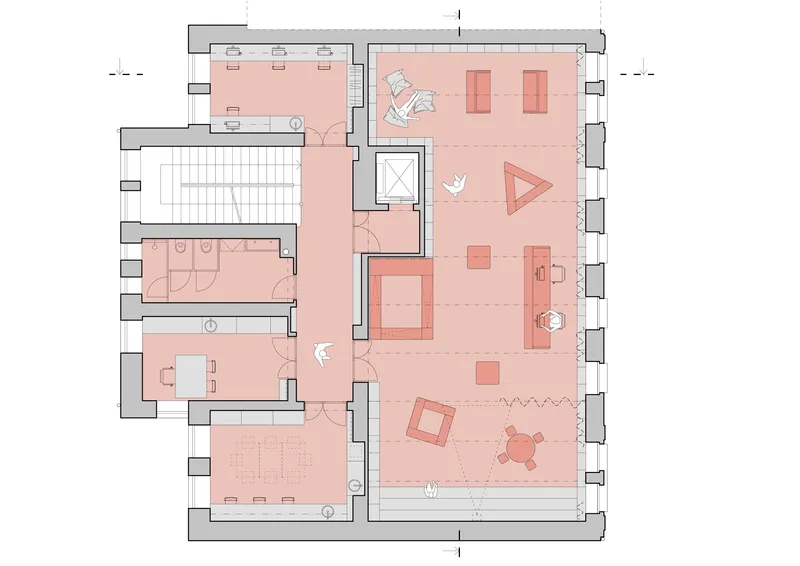 Floor plan drawing with pink-shaded rooms including exhibition spaces, seating areas, and a central stair void