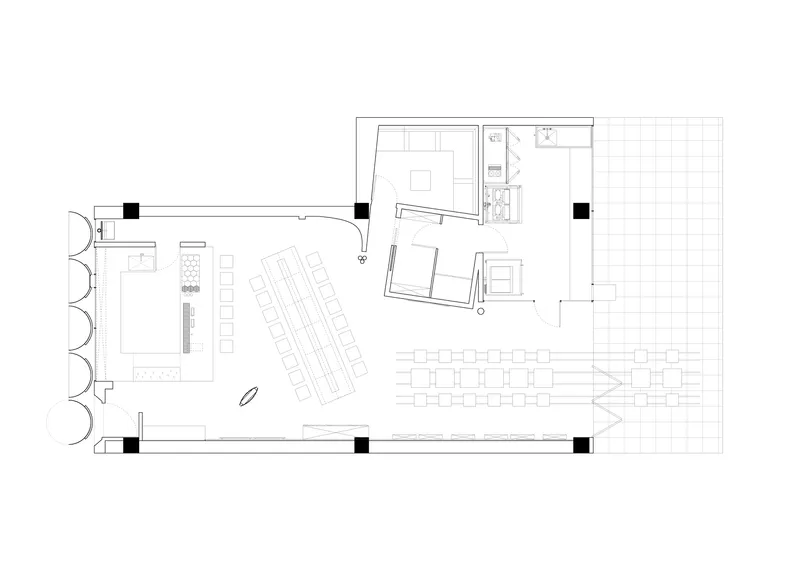 Floor plan drawing showing angled seating rows and service areas with outdoor terrace