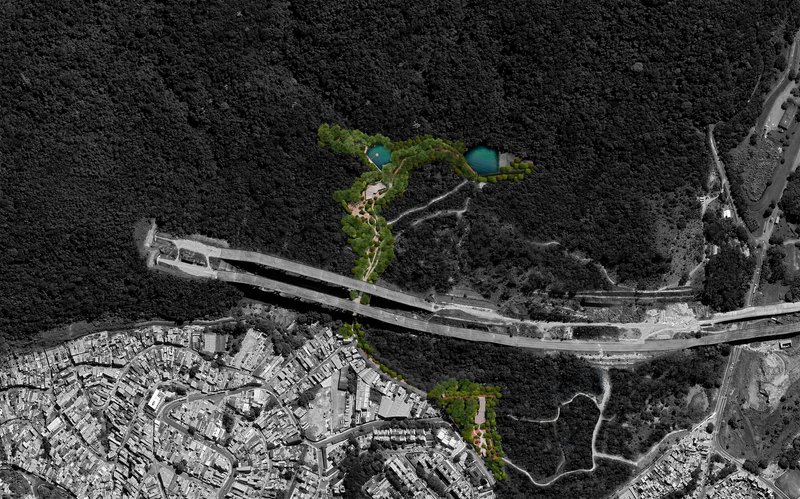 Drone view of the highlighted park corridor with colorized zones winding between residential development and forested hillside