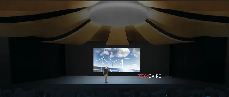 Auditorium stage hosting climate-focused presentations and talks