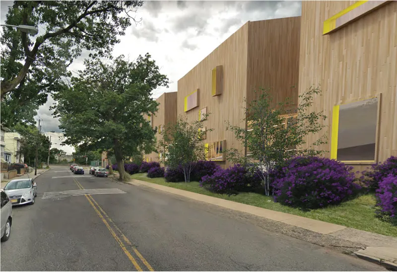 Street view of the Help Center, designed to integrate with the residential scale of Newark while creating a welcoming civic presence.