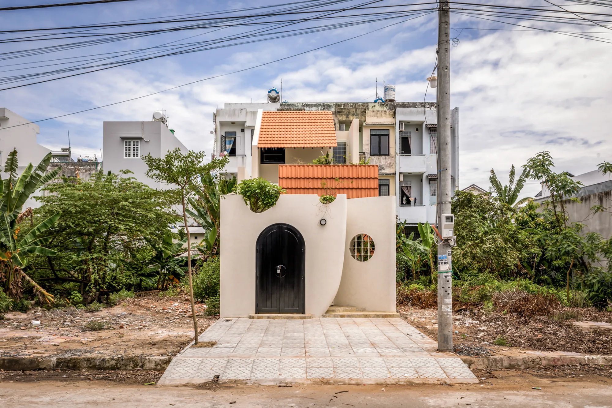 Nhà Voi 7 Gardens House: A Harmonious Urban Retreat by DA VÀNG Studio