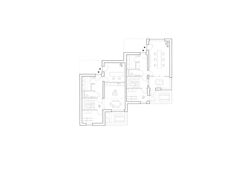 Floor plan drawing showing three interconnected residential units arranged in a stepped configuration