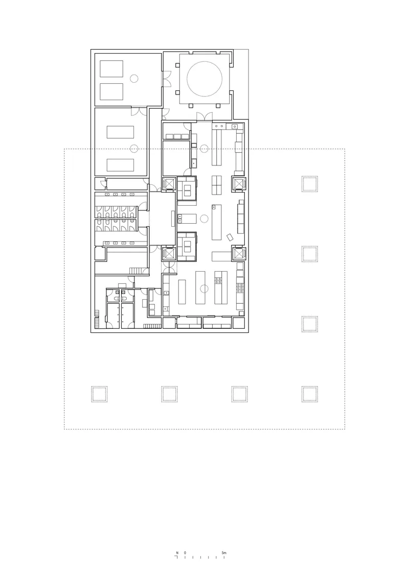 Ground floor plan drawing showing rooms arranged around a circular atrium with an adjacent courtyard