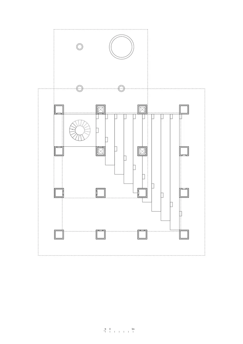 Floor plan drawing showing a spiral staircase and linear structural grid with column placement