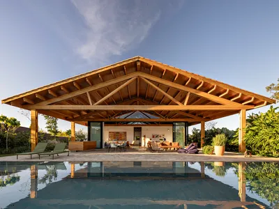 House MM Stretches a Timber Roof Across the Quiet