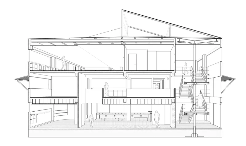 Section drawing revealing split-level interior spaces with stairs and pitched roof structure