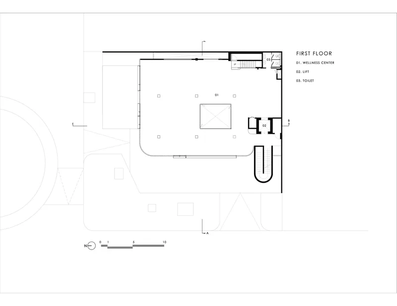 First floor plan showing wellness center with central volume and curved circulation