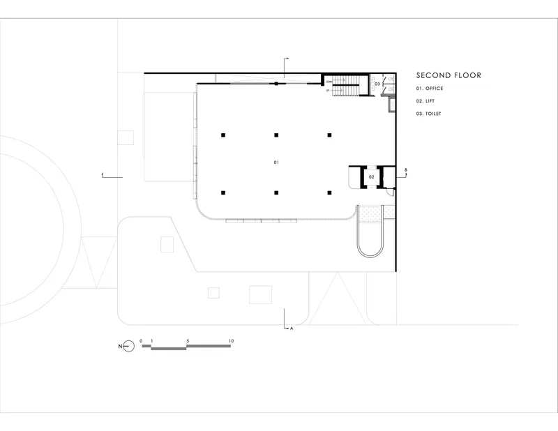 Second floor plan showing office space with grid of columns and lift core