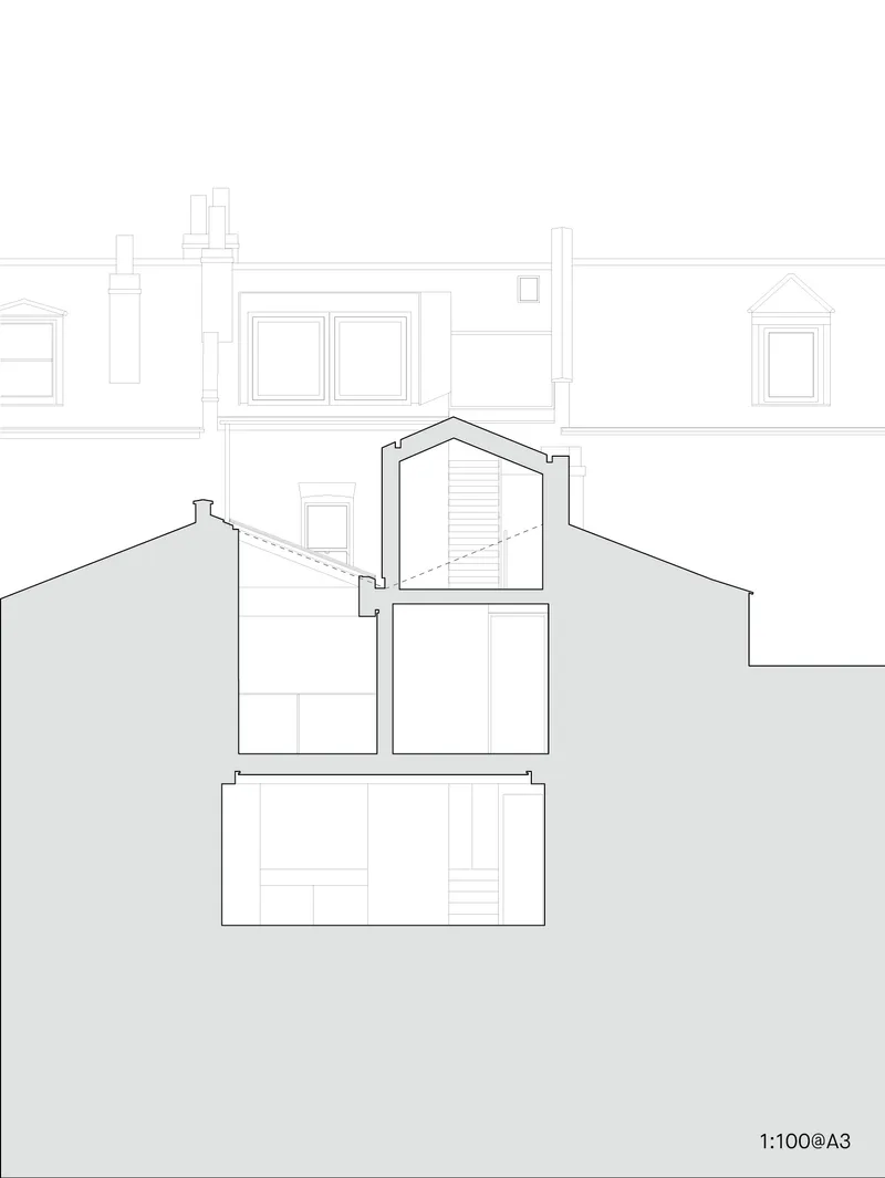 Section drawing revealing a gabled addition rising between neighbouring rooftops with existing party walls