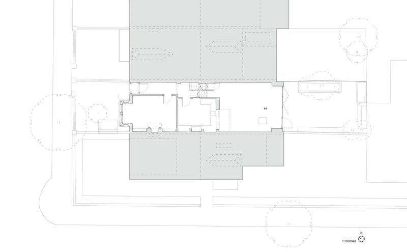 Floor plan drawing showing a central staircase with rooms and terraces arranged around it