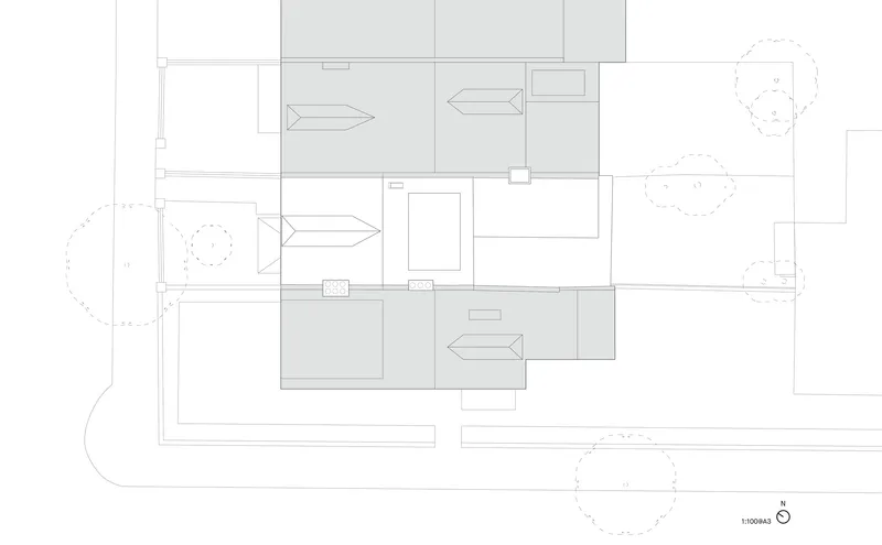 Roof plan drawing showing pitched roof volumes and directional arrows indicating slopes