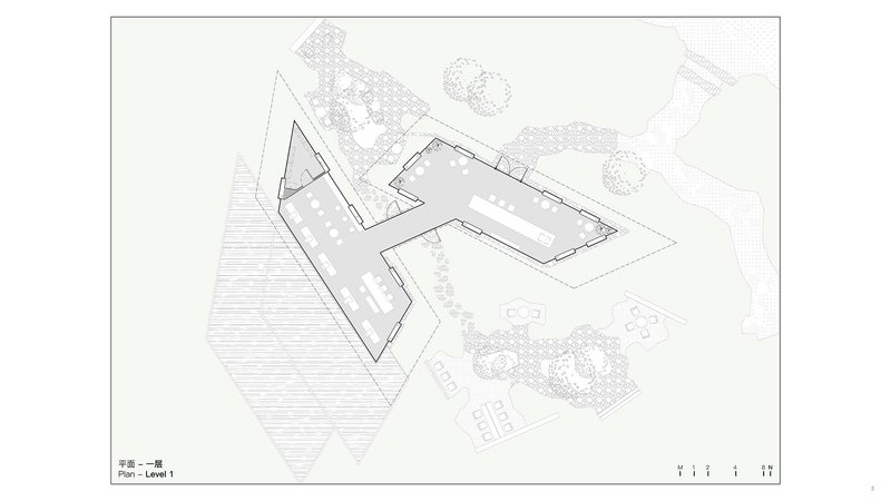 Site plan drawing showing angular building footprint with central courtyard adjacent to landscaped terraces