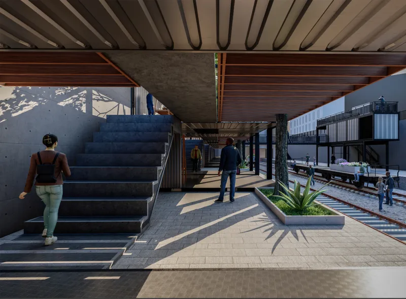 Modular container walkways activate the railway edge, creating layered circulation and shaded public corridors.