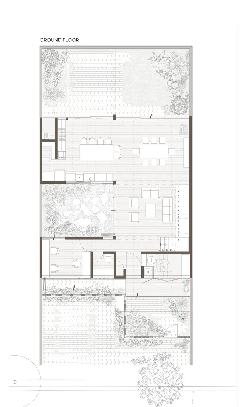 Ground floor plan showing open living area flanked by courtyards with planted gardens