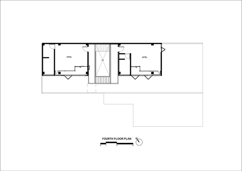 Fourth floor plan drawing showing two hotel rooms separated by a central stairwell
