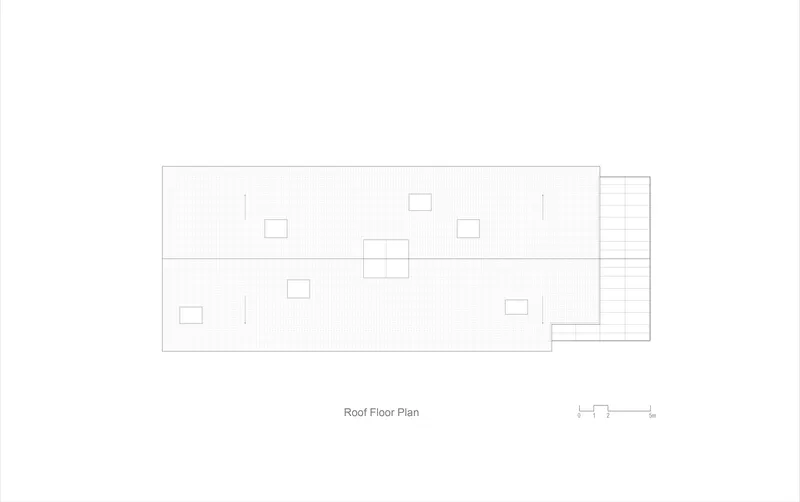 Roof plan drawing showing multiple skylight openings on a rectangular volume with exterior stairs