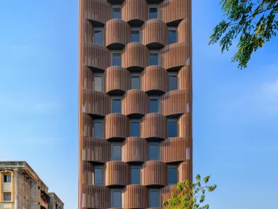 Sanjay Puri Architects Wraps a Nagpur Office Tower in Undulating Terracotta Ribs