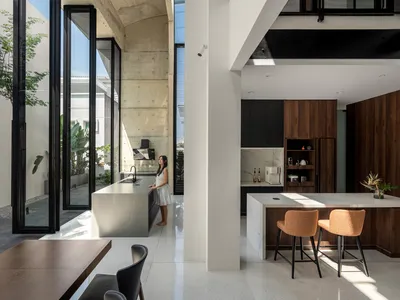 Core Design Workshop Carves Courtyards into a Zero-Lot Bungalow in Kuala Lumpur