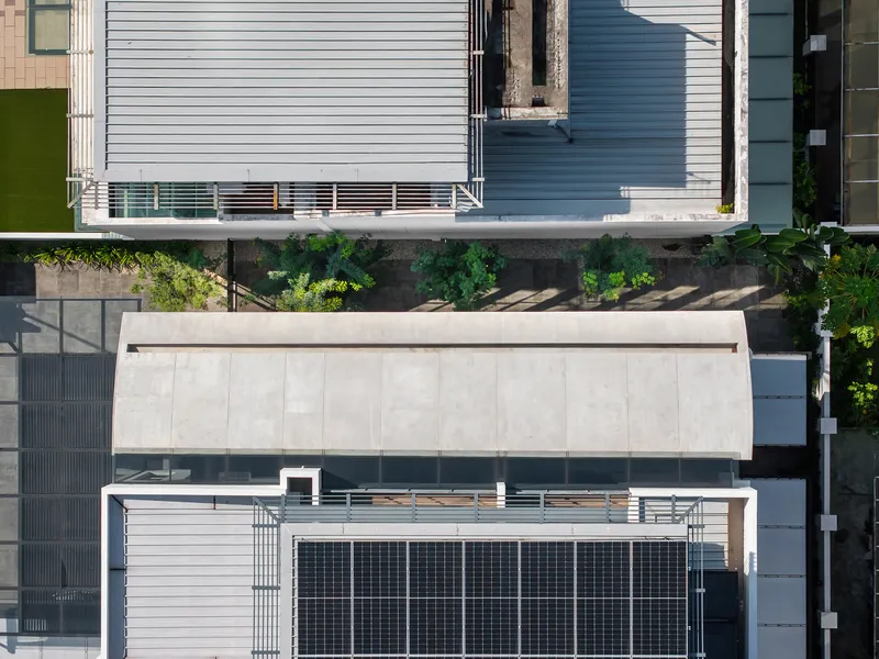 Aerial view of the rooftop terrace with solar panels and planted perimeter garden beds