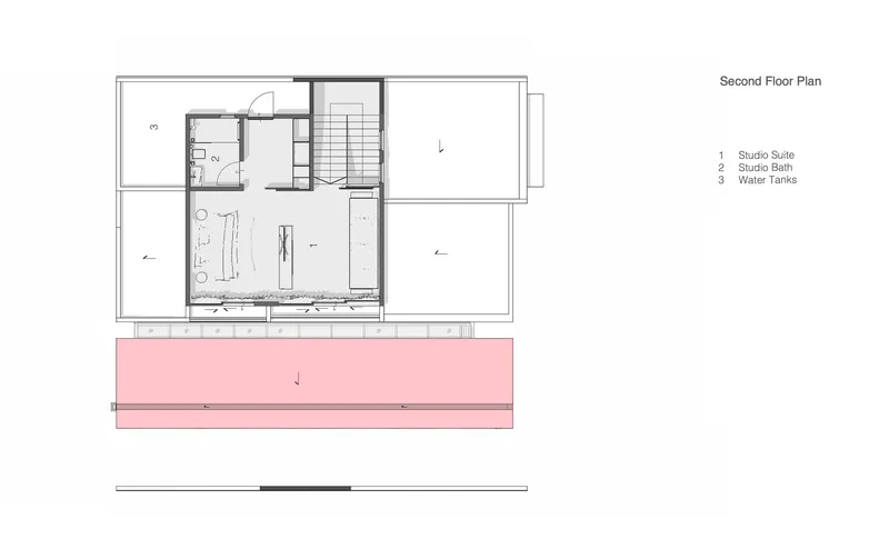 Second floor plan drawing showing studio suite with bathroom and cantilevered pink volume below