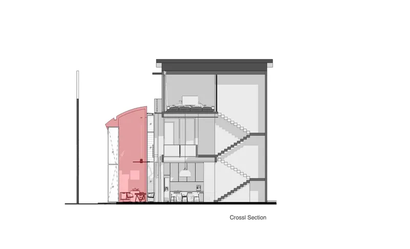 Cross section drawing showing staircase connecting three floors with pink-highlighted cylindrical element and water tanks